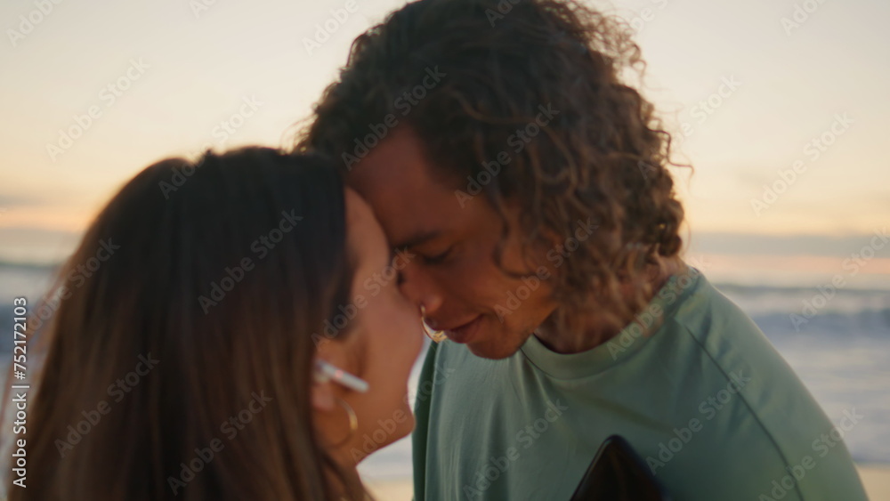 Fototapeta premium Affectionate couple enjoying music dancing morning ocean closeup. Lovers relax