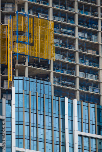 Construction site of a modern skyscraper with glass facade in centre of London