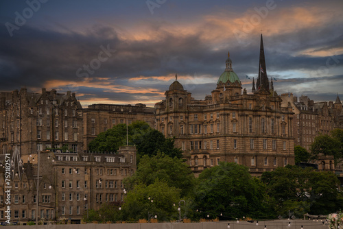 Majestic skyline with historic buildings in city of Edinburgh under cloudy sky