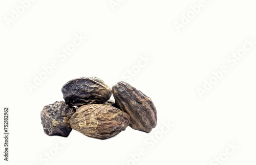 Terminalia Chebula or Haritaki Fruit Isolated on White Background with Copy Space, Also Known as Harad or Chebulic Myrobalan photo