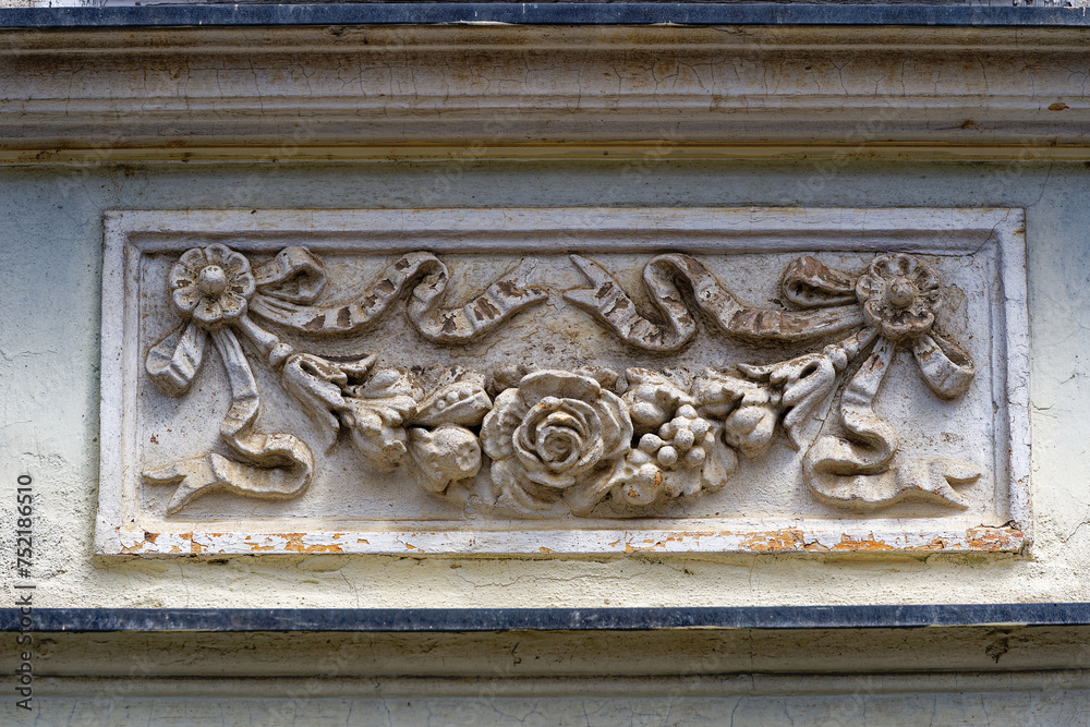 Old town of Slovenian City of Kranj with close-up of flower ornaments at historic house facade on a sunny summer day. Photo taken August 10th, 2023, Kranj, Slovenia.