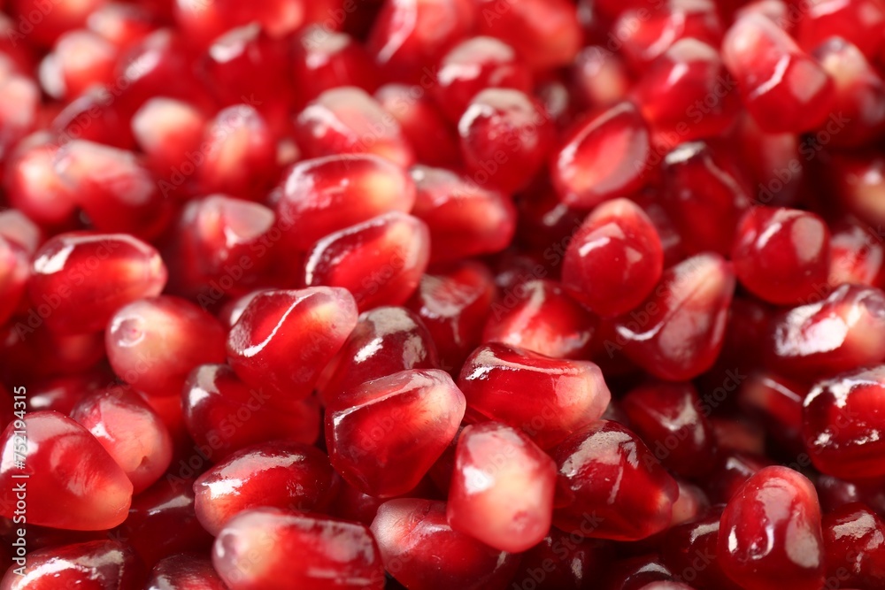 Ripe juicy pomegranate grains as background, closeup Ripe juicy pomegranate grains as background, closeup