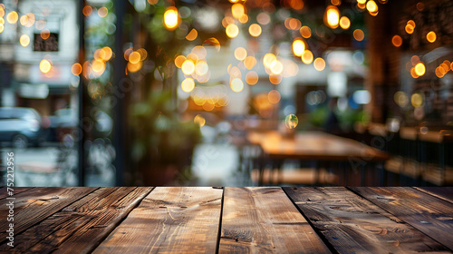 Empty wood table and blurred light bokeh table in cafe.