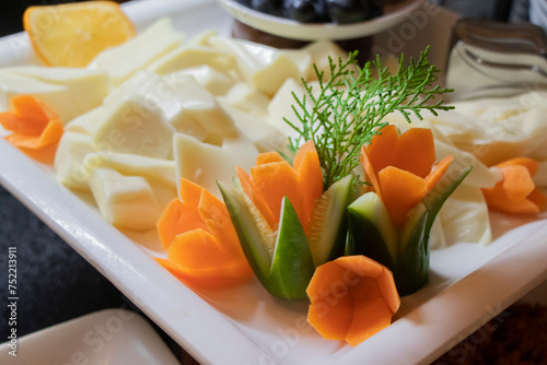 beautiful creative flowers made of vegetables served on a platter with cheese on vacation in Antalaya Turkey photo