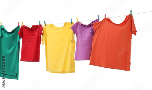 Colorful t-shirts drying on washing line isolated on white