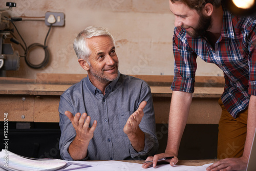 Architects, teamwork and men with blueprint in office for building, construction or repairs. Engineering, design and industrial apprentice plan and working on industry project with mentor in workshop photo