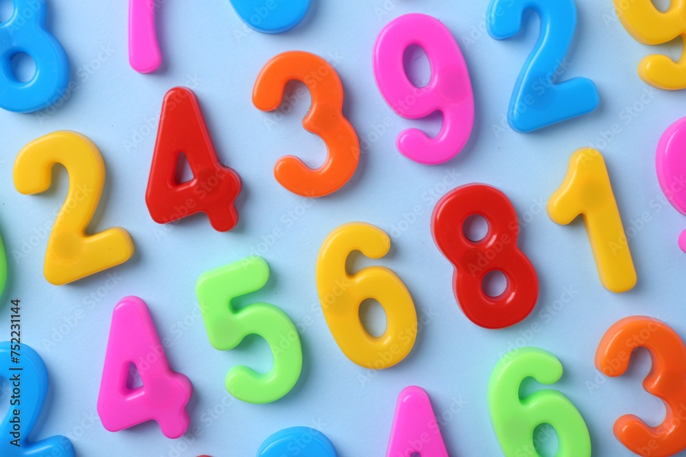 Fototapeta premium Colorful numbers on blue background, flat lay