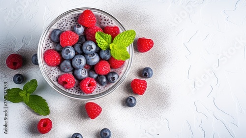 Wallpaper Mural Chia seeds pudding with raspberries, blueberries and mint on light table Torontodigital.ca