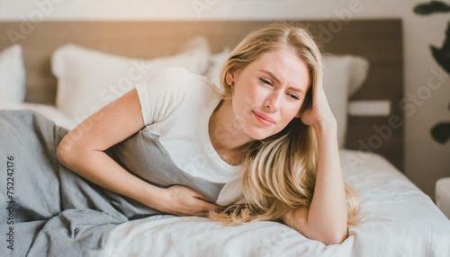 woman in bed with headache