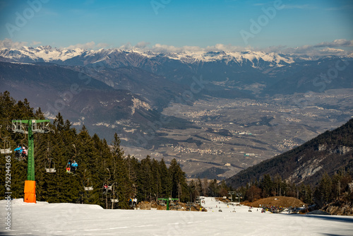 Ski resort Paganella Andalo, Trentino-Alto Adige, Italy. Ski slopes and snow holidays in Andalo in the Italian Dolomites, ski resort in the Alps. Snow covered Italian Dolomites at winter. photo