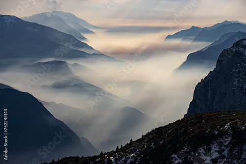 Lake garda view in  Trentino-Alto Adige, Italy. Ski slopes and snow holidays in Andalo in the Italian Dolomites, ski resort in the Alps. Snow covered Italian Dolomites at winter. photo