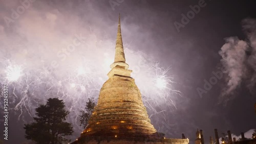 Beautiful fireworks celebration of Loy Krathong at Sukhothai Historical Park festival. Thai buddhist temple architecture at night. Loy Krathong at Sukhothai historical park , Sukhothai, Thailand photo