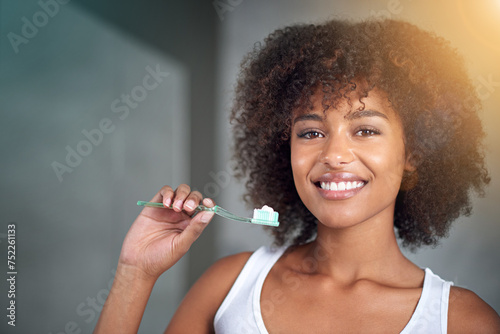 Black woman in portrait, toothpaste and toothbrush for teeth whitening in bathroom, dental health and self care for fresh breathe. Orthodontics, oral hygiene and morning routine with habit at home