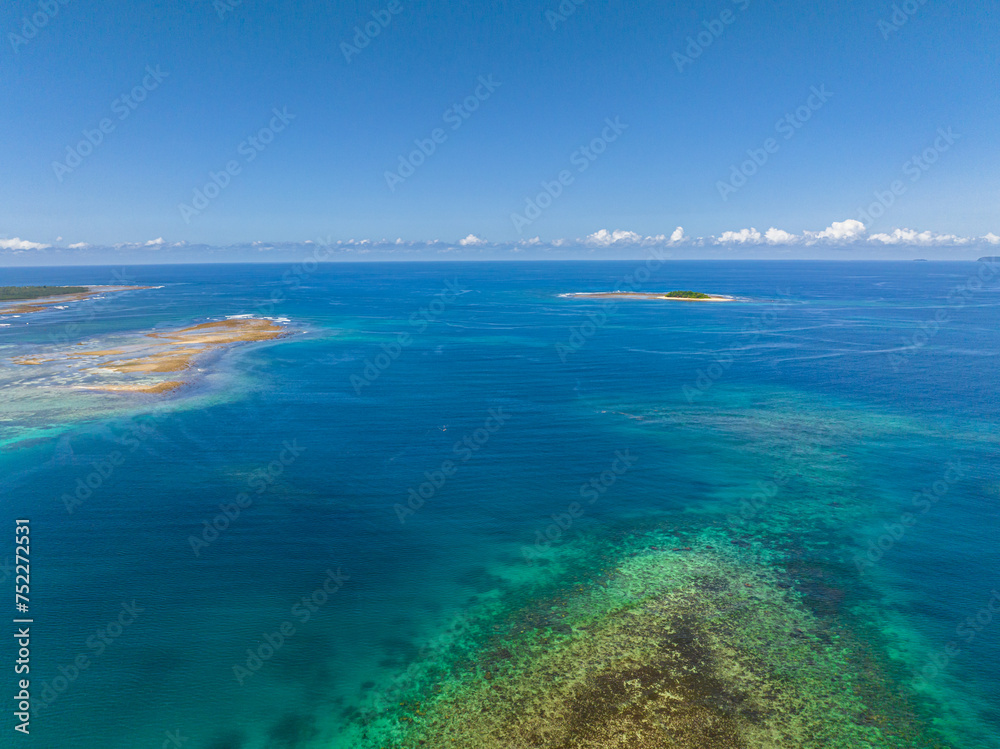 Blue sea and coral reef, Jobo Island in Britania Island. Mindanao, Philippines.