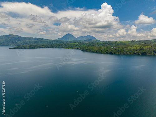 Lake Lanao and mountain with rainforest. Blue sky and clouds. Mindanao, Philippines. photo