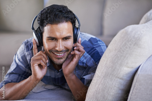 Photography Man, headphones and listening to song on couch, relax and streaming radio for music or sound
