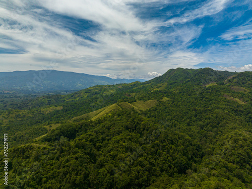 Fototapeta Naklejka Na Ścianę i Meble -  Mountains and green hills in Philippines. Mountain valley with evergreen vegetation. Mindanao.