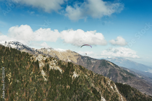 landscape with clouds and paraglider