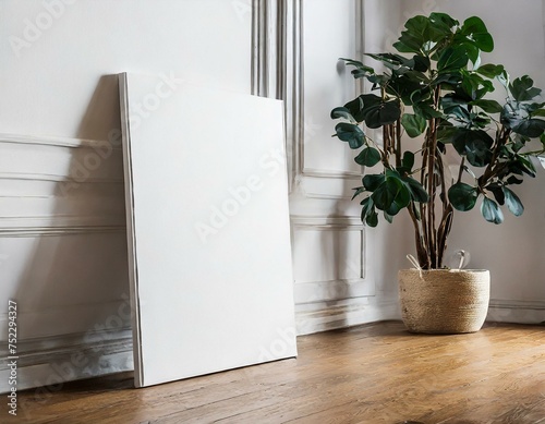 blank art canvas mockup on the laminate floor against a plain white wall