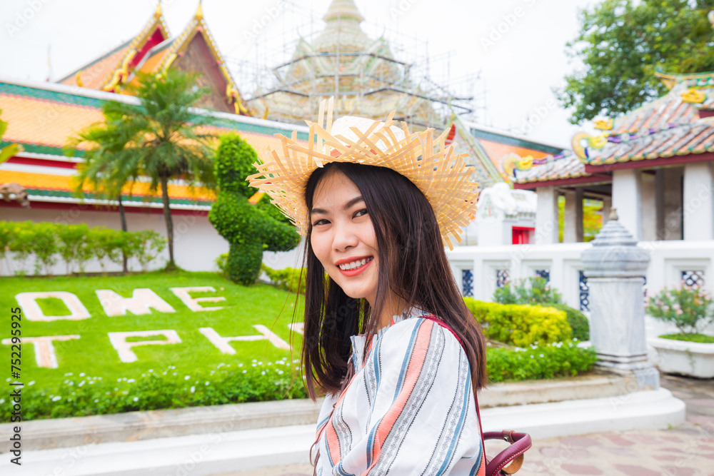Beautiful tourist asian woman backpack travel walking in buddha temple sightseeing