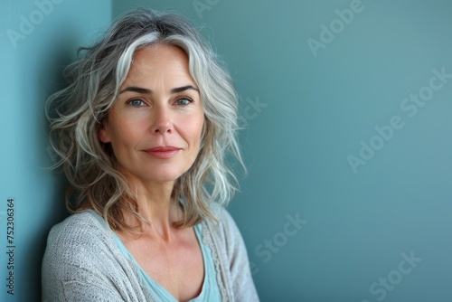 Mature woman model radiates joy, her skin glowing with dermatology care and good health.