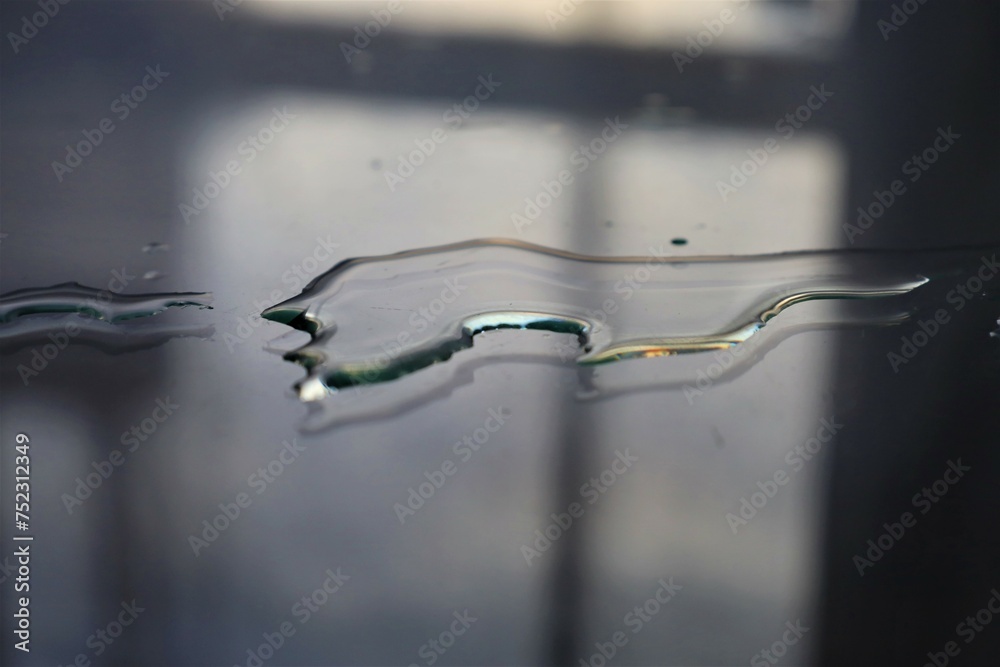 closeup  glass on wet reflective surface