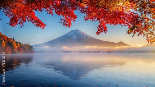 A breathtaking view of Mountain Fuji in the colorful autumn season, with morning fog gently hovering over Lake Kawaguchiko. The vivid red leaves of the surrounding trees contrast , AI Generative