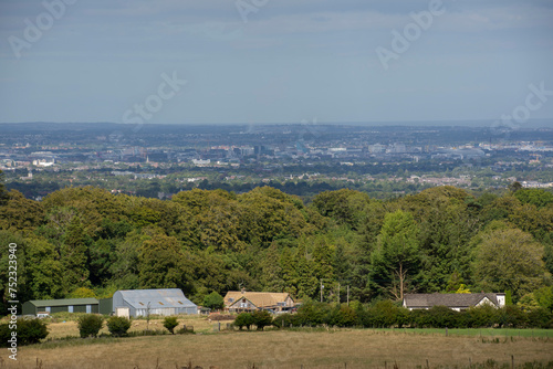 Overlooking the vibrant tapestry of Dublin City from the tranquil heights of the Dublin Mountains  where urban energy meets the calming embrace of nature.