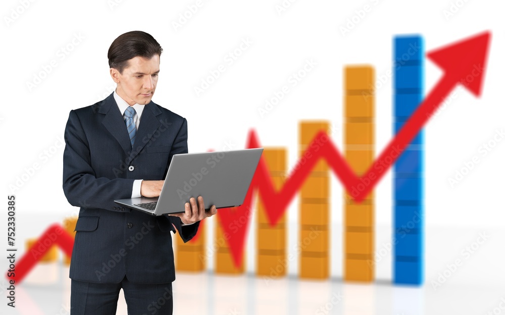 Logistics Expert with Laptop Computer And graph Logistics Expert with Laptop Computer And graph