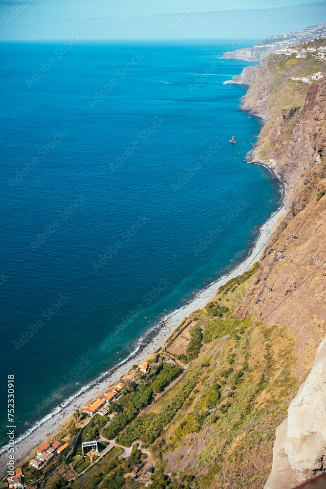 Madeira Island coastline scenery, Turquoise water and green fields