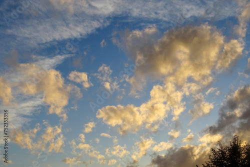 spectacular sky towards sunset with scattered clouds moved by the wind
