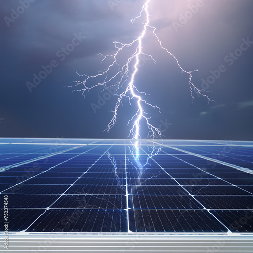 Solar panel and stormy cloudy sky with thunder and lightning reflection - concept of sustainable and renewable sources.