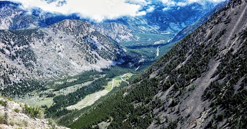 Spectacular view at Beartooth Highway Wyoming. A Drive of incredible beauty. Yellowstone. Alpine mountains covered by snow and green woods. Northwest. Majestic beartooth mountains landscape. Road trip