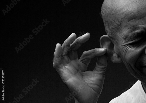 deaf man suffering from deafness and hearing loss on grey background with people stock image stock photo 