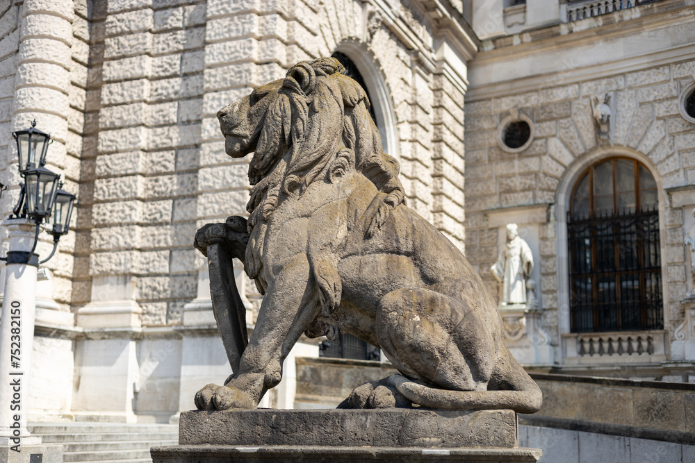Lion statue at Hofburg palace on Heldenplatz square in Vienna, Austria