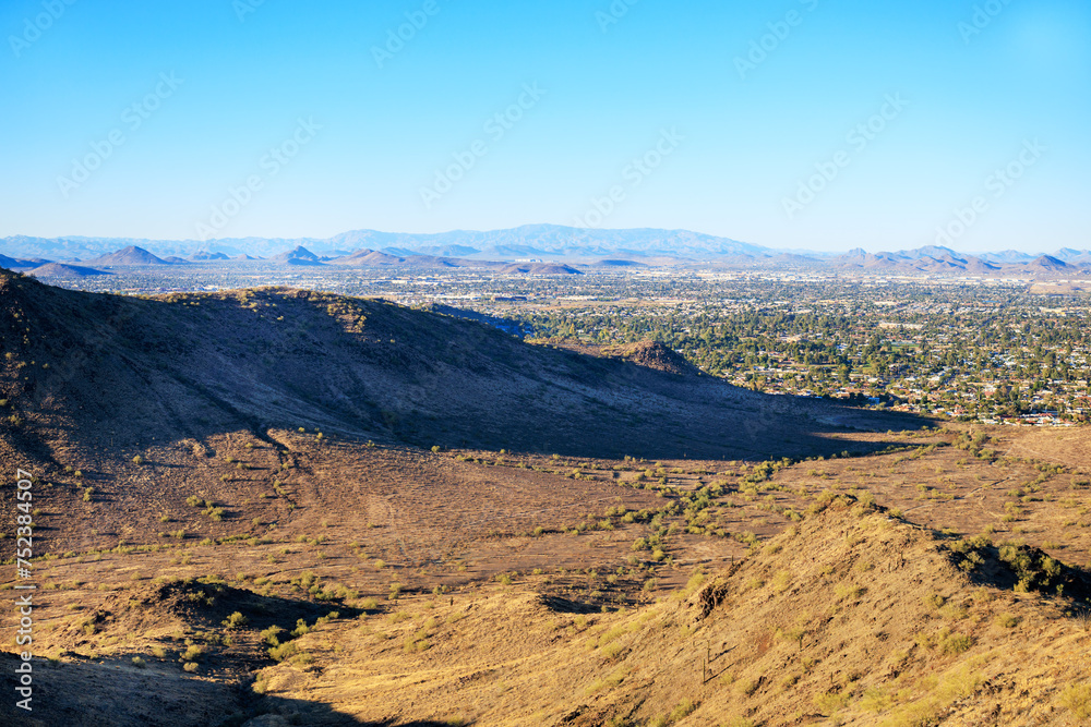 Late afternoon over northern part of Valley of the Sun bordered by low raising mountain chain, Phoenix, Arizona.