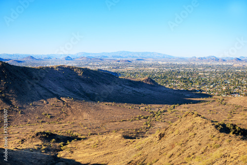 Late afternoon over northern part of Valley of the Sun bordered by low raising mountain chain  Phoenix  Arizona.