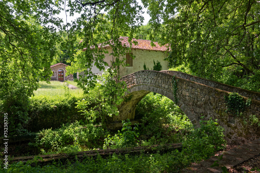 View of a traditional stone bridge at the village of Ano Karyofyto in Thrace, Greece View of a traditional stone bridge at the village of Ano Karyofyto in Thrace, Greece