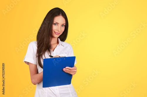 Portrait of a young woman hold notebook smiling