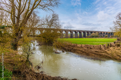 A view down the River Welland towards the spectacular Harringworth Viaduct on a bright winter day photo