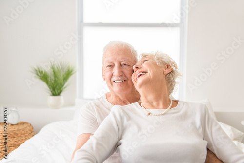 Senior 80 years old Couple Relaxing In Bed together