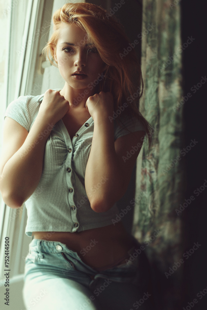 Beautiful girl at the window