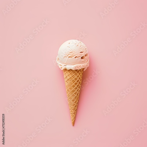 An ice cream cone sits on a vibrant pink background.