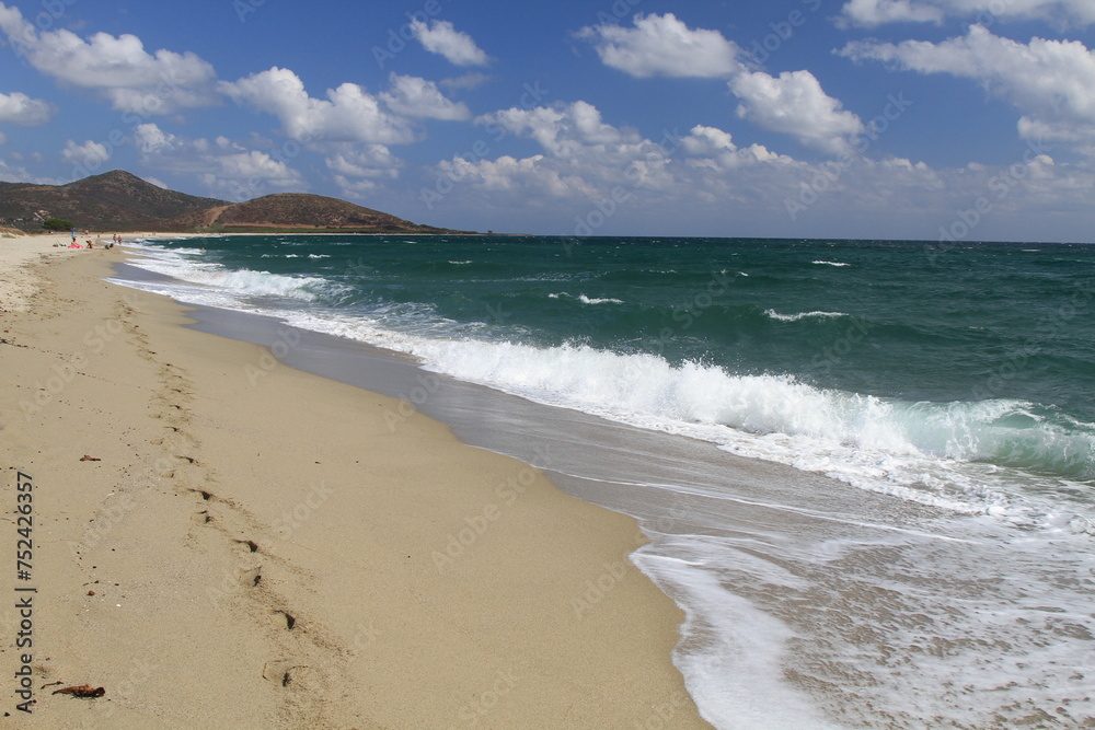Turquoise sea water and blue sky in the beautiful beach of Su Tiriarzu in La Caletta, Siniscola in Sardinia, Italy