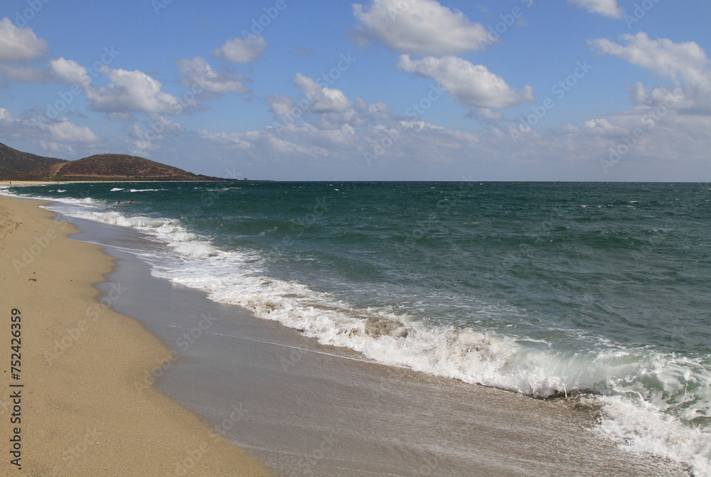 Turquoise sea water and blue sky in the beautiful beach of Su Tiriarzu in La Caletta, Siniscola in Sardinia, Italy