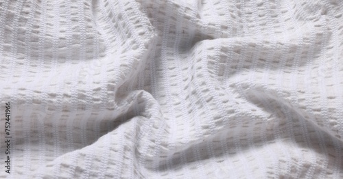 Texture of light crumpled fabric as background, closeup