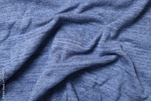 Texture of blue crumpled fabric as background, top view