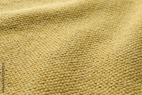 Texture of golden color fabric as background, closeup