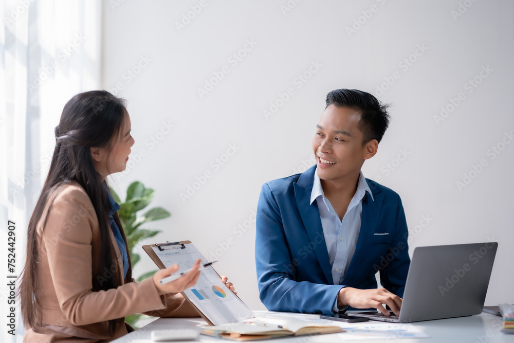 Business consultation between a male and female professional. Corporate strategy and teamwork concept. Business consultation between a male and female professional. Corporate strategy and teamwork concept.