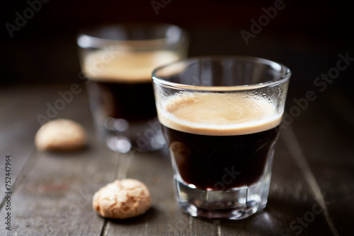 Two Glasses Of Coffee on dark wooden background. Close up.	